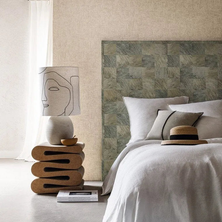 Wallpaper installed in a room showing its full pattern, color