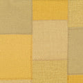 Patchwork of beige and yellow squares with a textured pattern