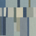Textured wallpaper with a pattern of blue, green, and beige stripes.