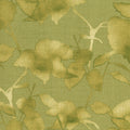 Patterned fabric with green leaves on a green background