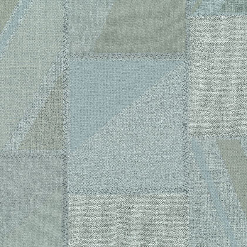 Textured fabric with a patchwork pattern in shades of green and gray.